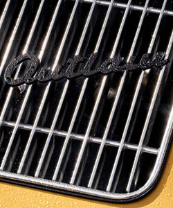 Black Outlaw Script Grill Badge