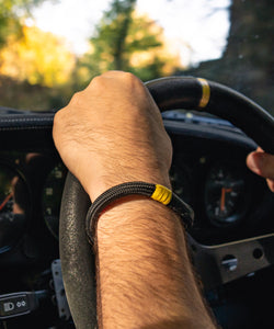 Steering Wheels Inspired Yellow Marker On Black Rope Bracelet With Black Steel D Shackle