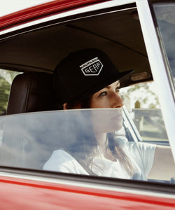 Black Trucker Cap With White Outlaw Gear Embroidered Logo Snap Back