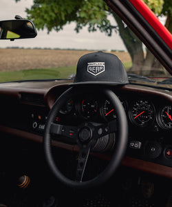 Black Trucker Cap With White Outlaw Gear Logo Flat Embroidery