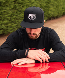 Black Trucker Cap With White Outlaw Gear Embroidered Logo Snap Back